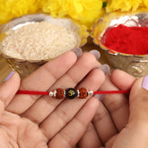 Dual Rudraksha With Black Om Stone Silver Bead Rakhi